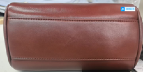 chic brown leather cylinder crossbody bag