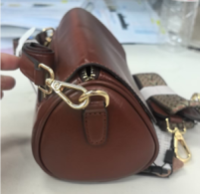 chic brown leather cylinder crossbody bag